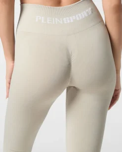 Beżowe legginsy z logo