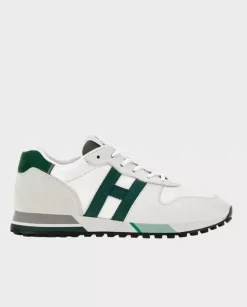 Beżowe sneakersy z zielonym logo