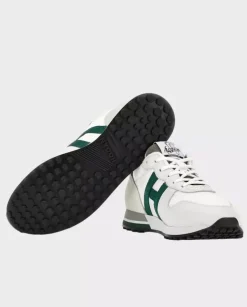 Beżowe sneakersy z zielonym logo