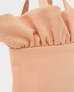 Brzoskwiniowa torebka z falbanką mini