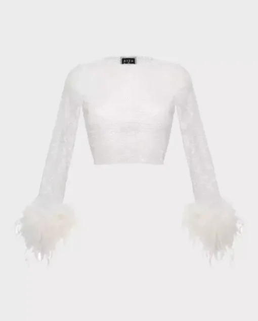 Połyskujący crop top z piórami