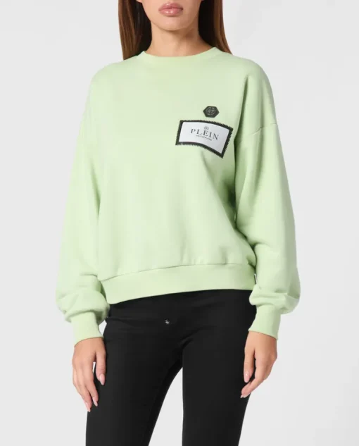 Zielona bluza z naszywką z logo