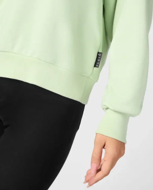 Zielona bluza z naszywką z logo